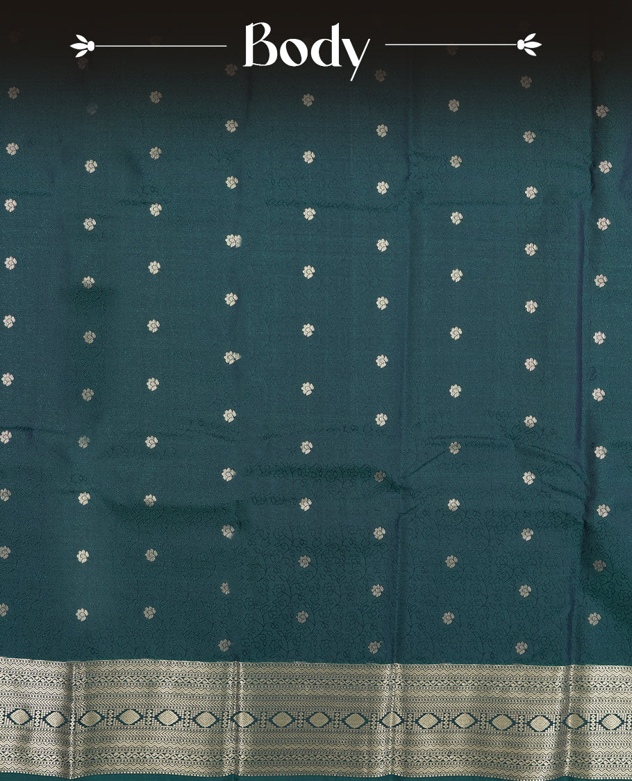 Teal Green colour semi soft silk saree featuring a self coloured textured with golden patterned body, complemented by self coloured golden zari motifes on pallu & border and a matching blouse piece.