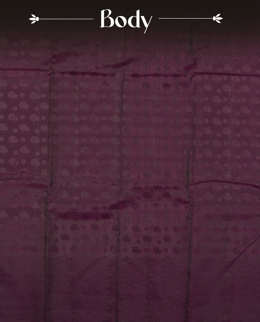 Dark wine colour semi soft silk saree featuring a self coloured textured patterned body, complemented by self coloured motifs on pallu & border and a matching blouse piece.