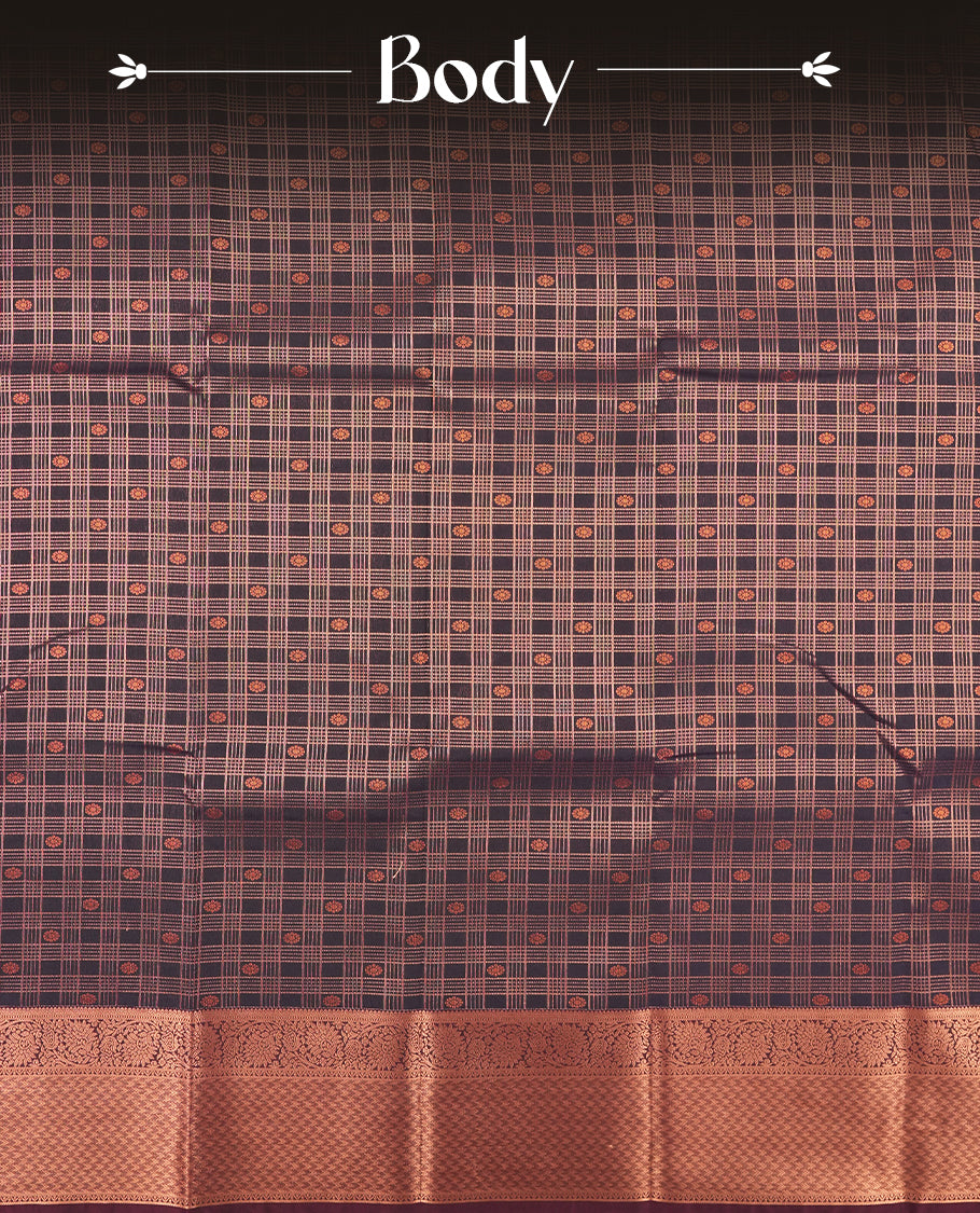 Dark blue colour Semi Silk Saree with copper zari checkered on the body, paired with a contrast chocolate brown colour pallu with copper zari traditioal border, and a matching blouse piece.