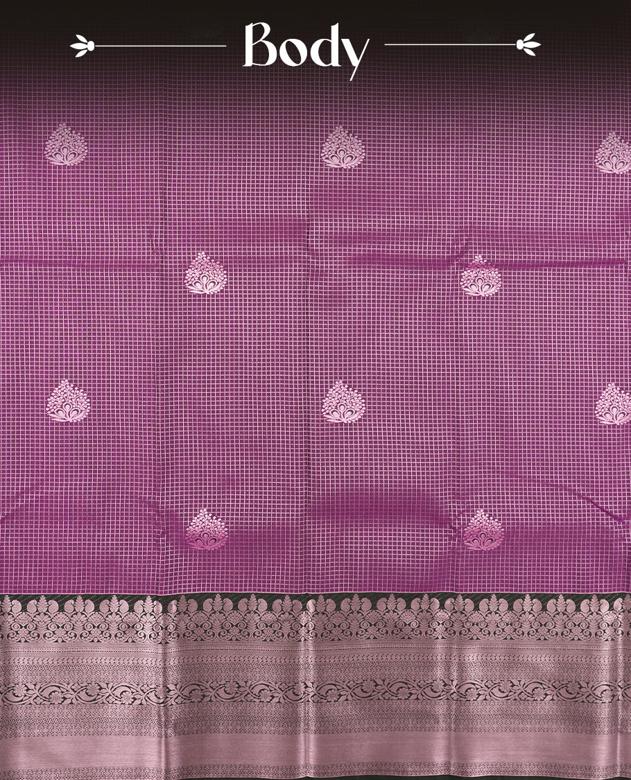 Purple colour Semi Silk Saree with rose gold zari checkered on the body, paired with a contrast Dark green colour pallu with Rose gold zari traditioal border, and a matching blouse piece.