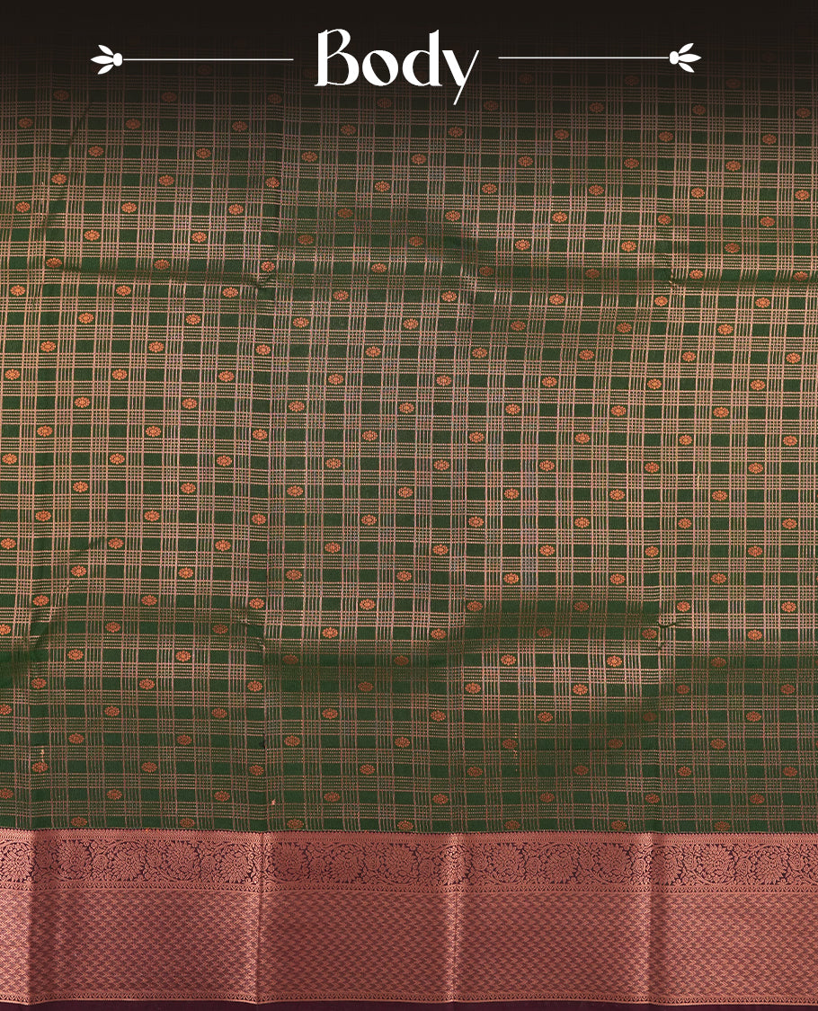 Dark green colour Semi Silk Saree with gold zari stripes on the body, paired with a contrast Burnt maroon colour pallu with gold zari traditioal border, and a matching blouse piece.