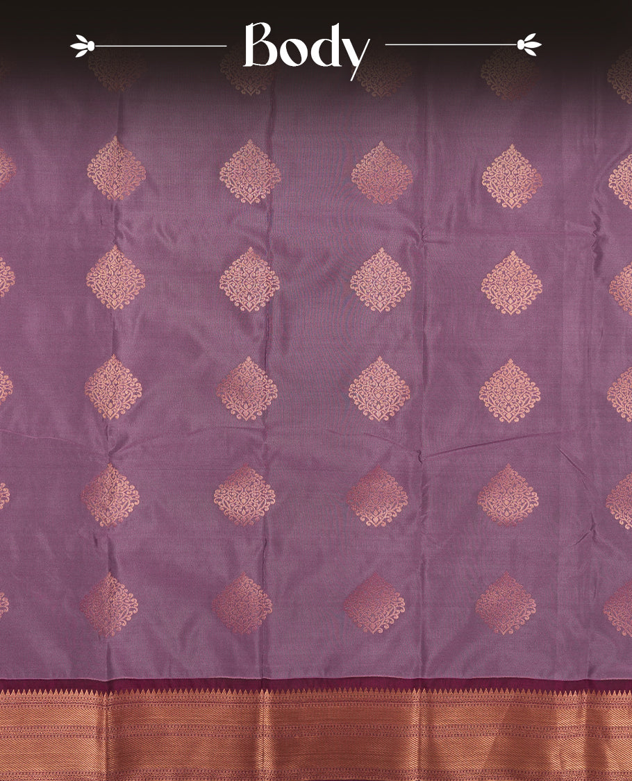 Light purple colour Semi Silk Saree with gold zari motifs on the body, paired with a contrast Wine colour pallu with copper zari traditioal border, and a matching blouse piece.