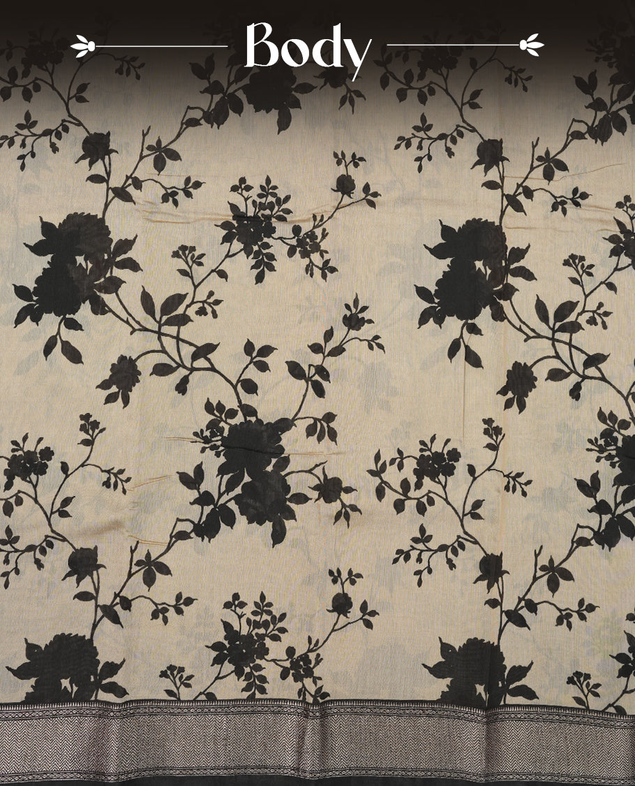 Cream colour Viscos semi printed saree featuring a contrast black light golden zari border, abstract Black printed motifs on the body, and comes with a matching blouse