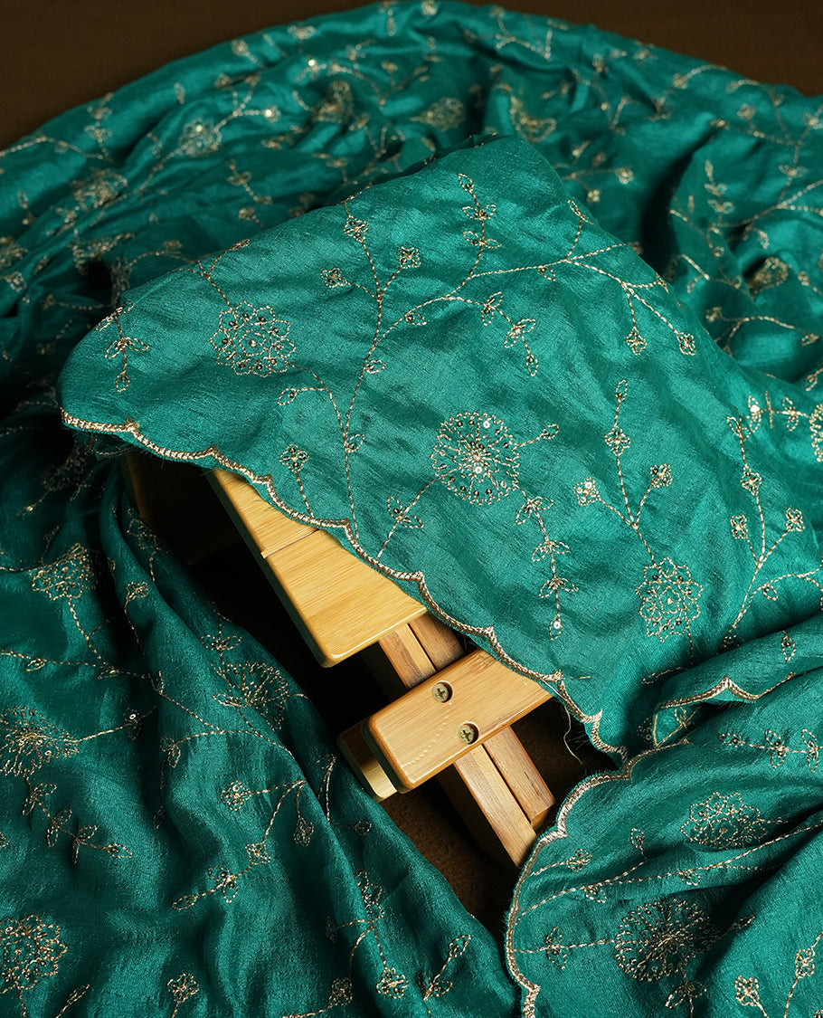 Olive colour churidhar material featuring thread embroidery on the front panel, contrast Green colour dupatta with elegant border, and matching plain bottom