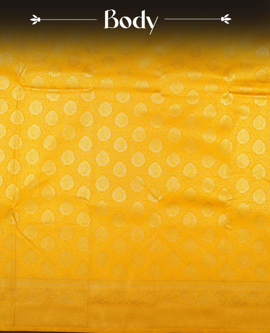 Yellow colour semi silk brocade saree featuring intricate Gold butta patterns across the body, complemented by a rich self colour woven border and pallu, paired with a matching blouse.