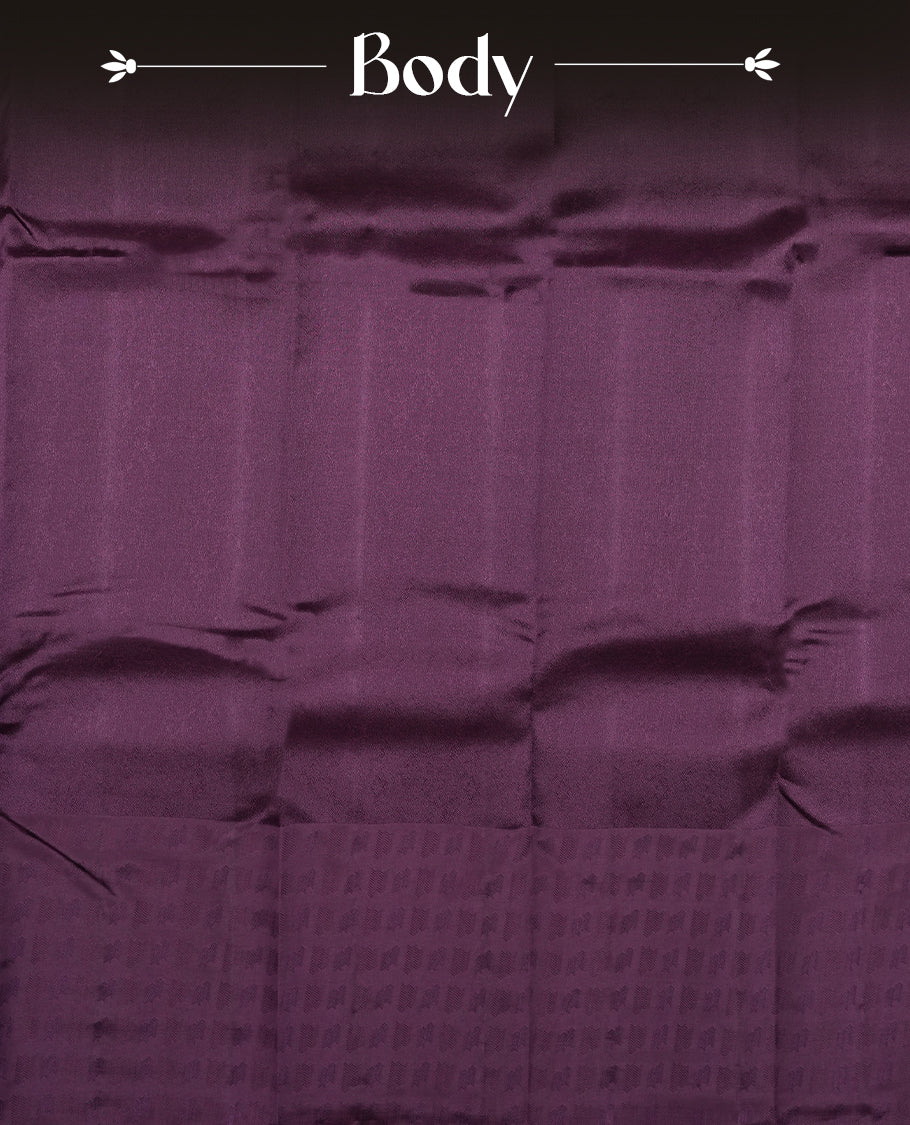 Dark purple colour semi soft silk saree featuring a self coloured textured patterned body, complemented by self coloured motifes on pallu & border and a matching blouse piece.