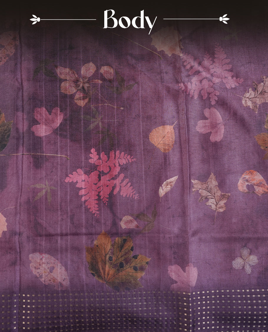 Grape colour tussar saree featuring woven Eco leaves printed on the body, complemented by a self colour gold zari bindi butta border & pallu, paired with a matching blouse.