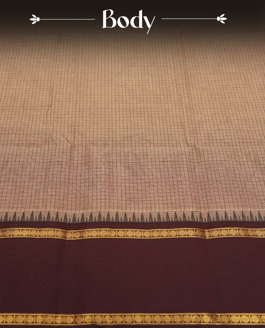 Brown colour checked Chettinad cotton saree featuring intricate black checks on the body, enhanced with golden zari borders and temple motifs & Comes with a matching blouse piece for a traditional look.