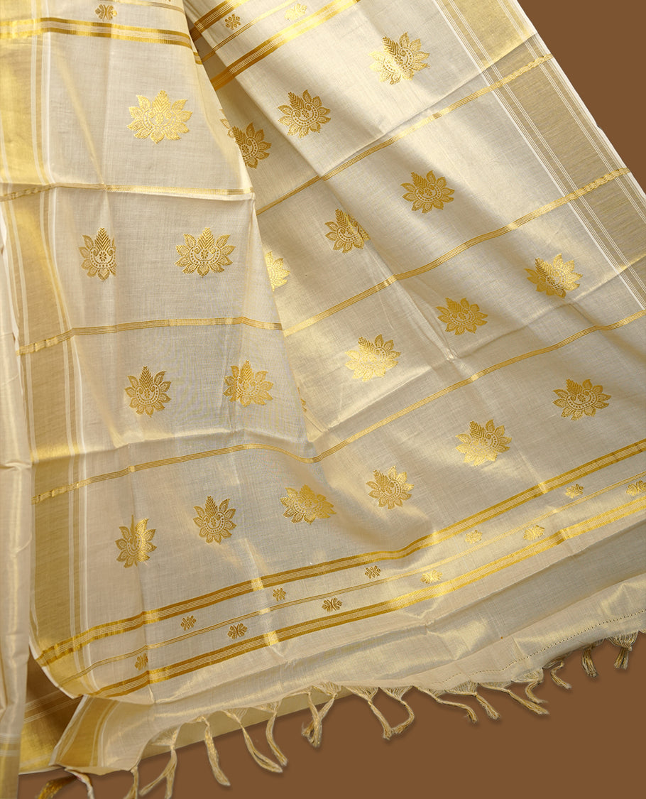 Elegant Light gold colour tissue Kerala saree with gold zari buttas, broad kasavu border, and richly woven traditional pallu, paired with a matching blouse