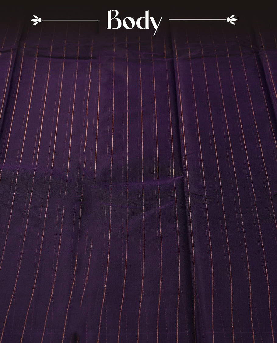 Dark violet colour silk cotton saree featuring with delicate vertical copper zari lines on the body, rich blue contrasted border & Crafted without a border for a classy touch, Comes with a matching blouse for a perfectly coordinated look.
