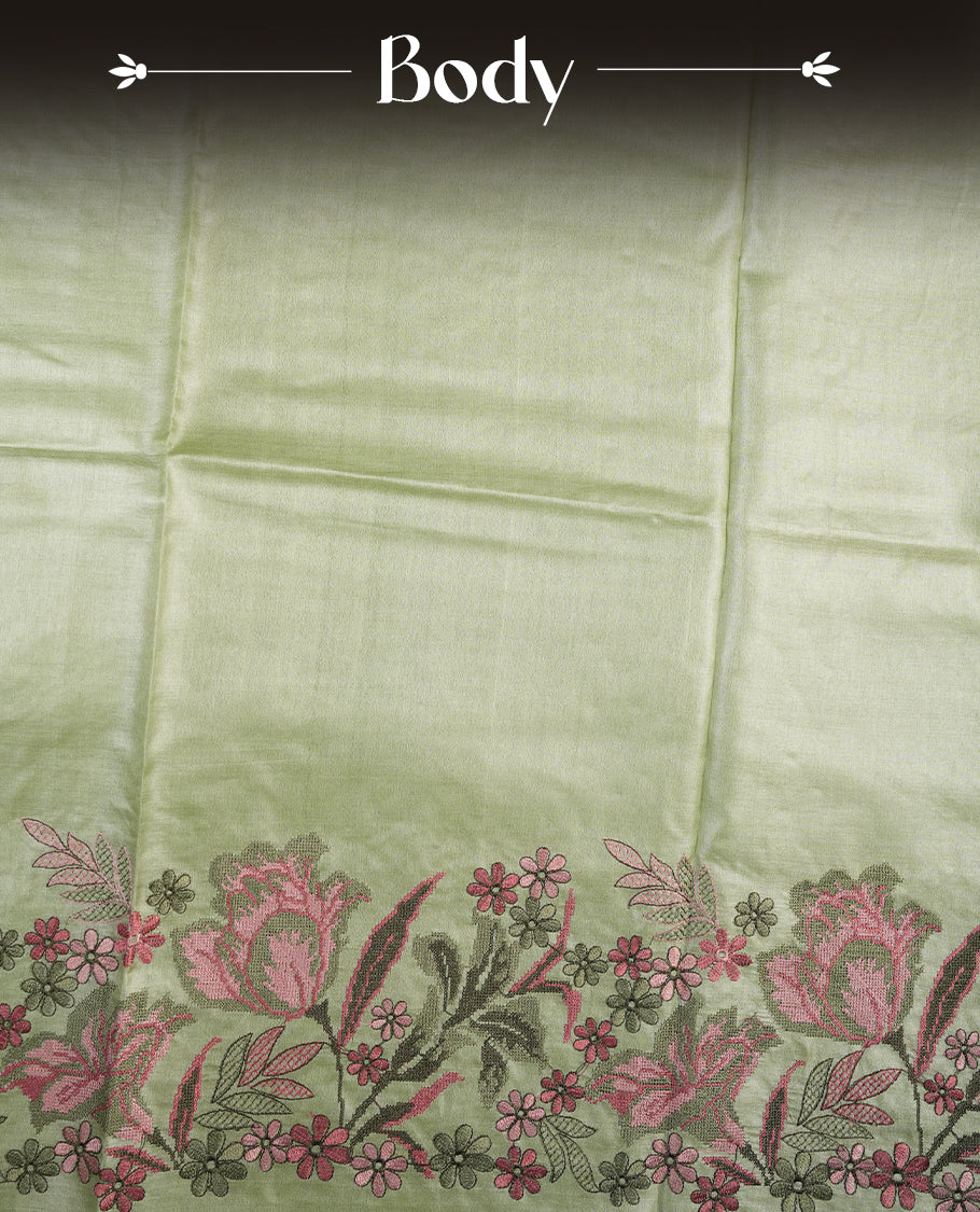 Pastel green colour Pure tusser silk saree featuring finely crafted floral thread embroidery detailing on the border, pallu and with matching blouse piece.