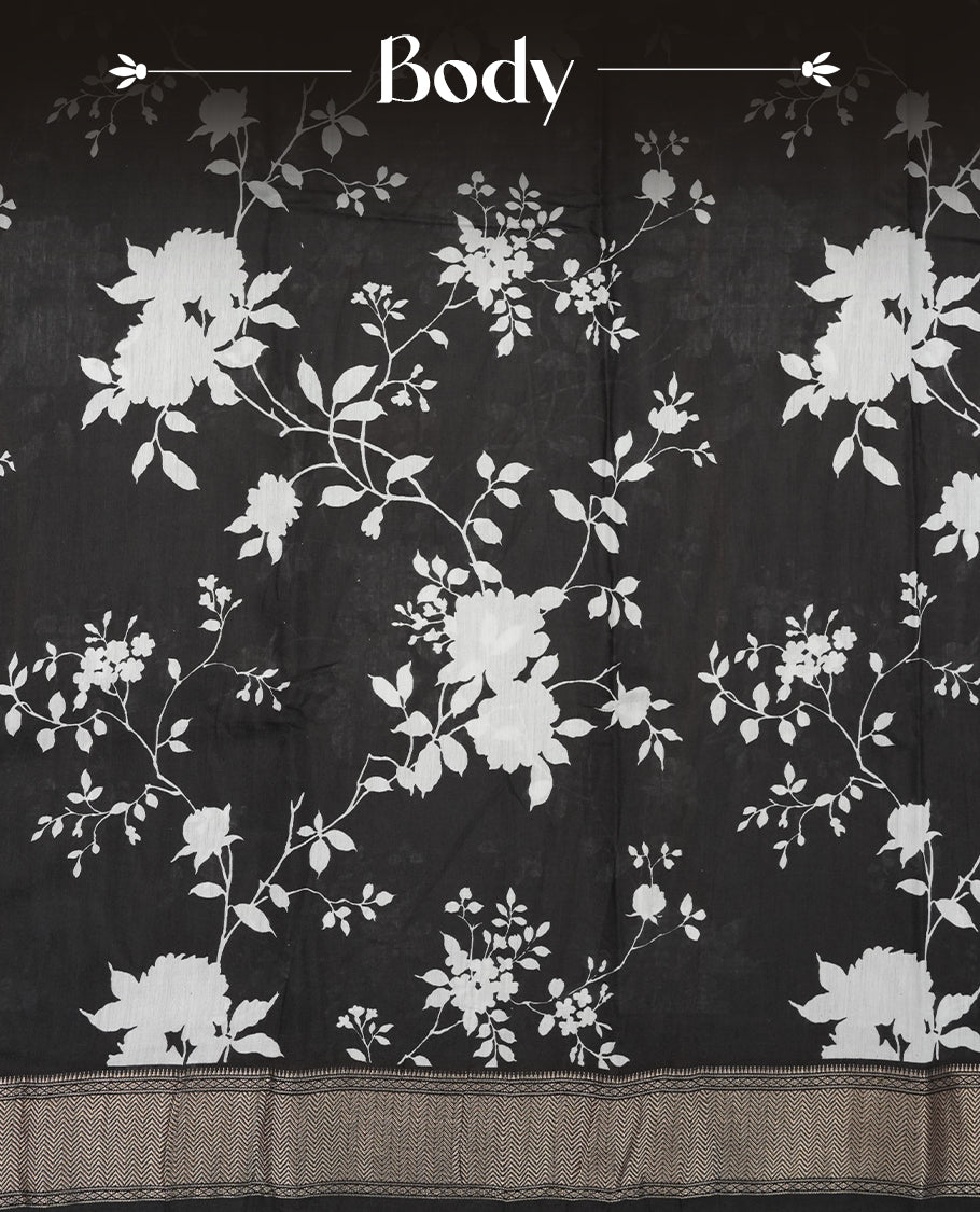 Black colour Viscos semi printed saree featuring a light golden zari border, abstract white printed motifs on the body, and comes with a matching blouse