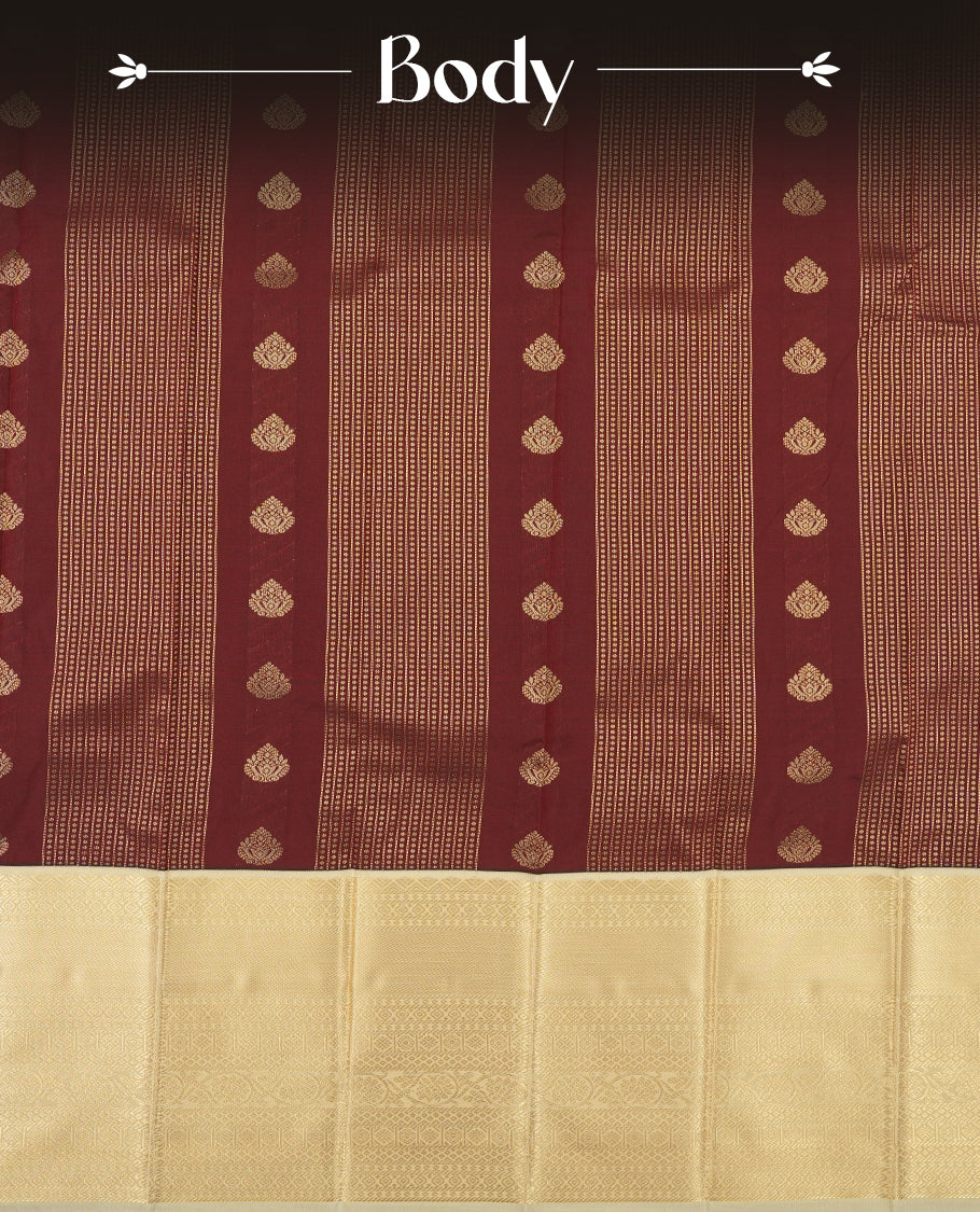 Dark brown colour Semi Silk Saree with gold zari patterns on the body, paired with a contrasting cream colour traditional pallu and border, and a matching blouse piece.