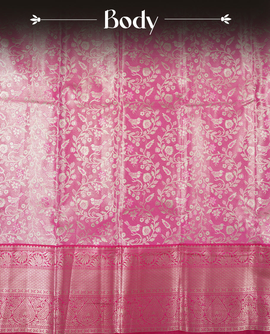 Bright pink colour and silver Zari Tissue Brocade Saree features intricate floral Motifs on body and dark pink contrast with silver traditional border & pallu, paired with matching blouse