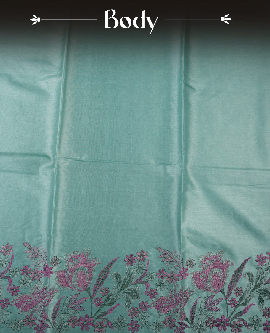 Pastel blue colour Pure tusser silk saree featuring finely crafted floral thread embroidery detailing on the border, pallu and with matching blouse piece.
