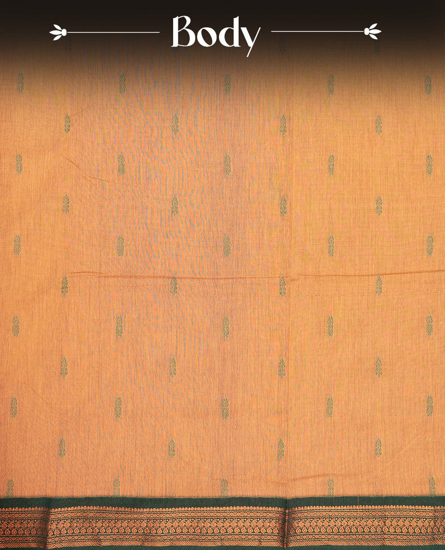 Pastel Orange colour Kalyani cotton saree with intricate small motifs all over, paired with a contrasting dark green rich zari woven border and pallu & Comes with a matching blouse piece