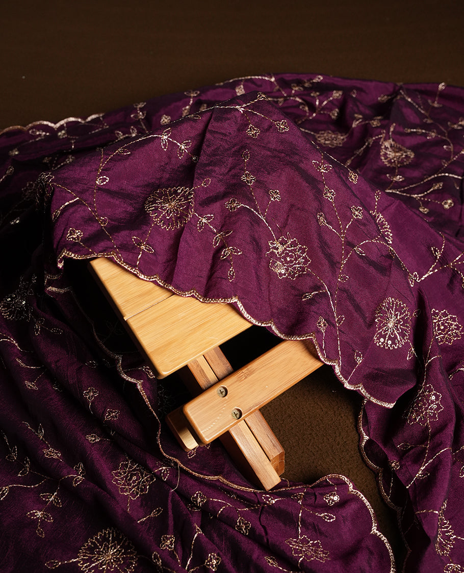 Golden Cream colour churidhar material featuring thread embroidery on the front panel, contrast Dark Purple colour dupatta with elegant border, and matching plain bottom