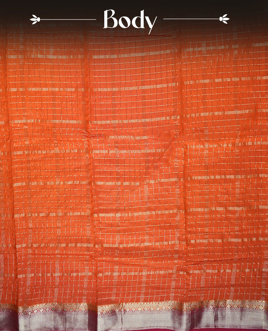 Coral orange colour mixed chanderi cotton saree with zari checkered body, rosegold zari border, magenta-pink pallu with zari checks, and matching magenta blouse.