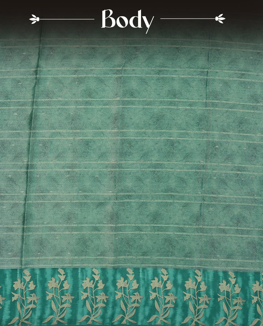 Light Aqua green colour semi tussar saree adorned with Cream strip printed pattern across the body and Floral pattern contrast Aqua green colour on border, paired with a matching blouse.
