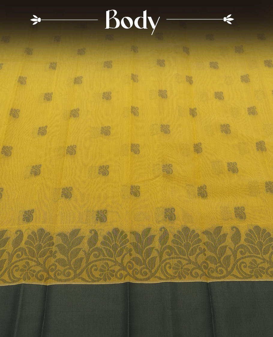 Chrome yellow colour silk cotton saree featuring elegant floral zari motifs on the body, complemented by a rich contrast dark plain grey border and pallu with traditional woven detailing & Comes with a matching blouse piece.