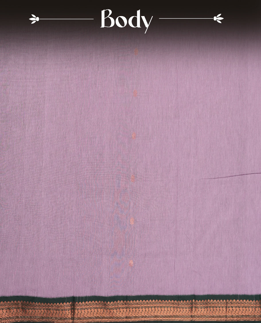 Lavender colour Kalyani Cotton saree with delicate woven zari motifs all over, paired with a contrasting deep green border and pallu intricately woven with rich copper peacock zari & Comes with a matching blouse piece.