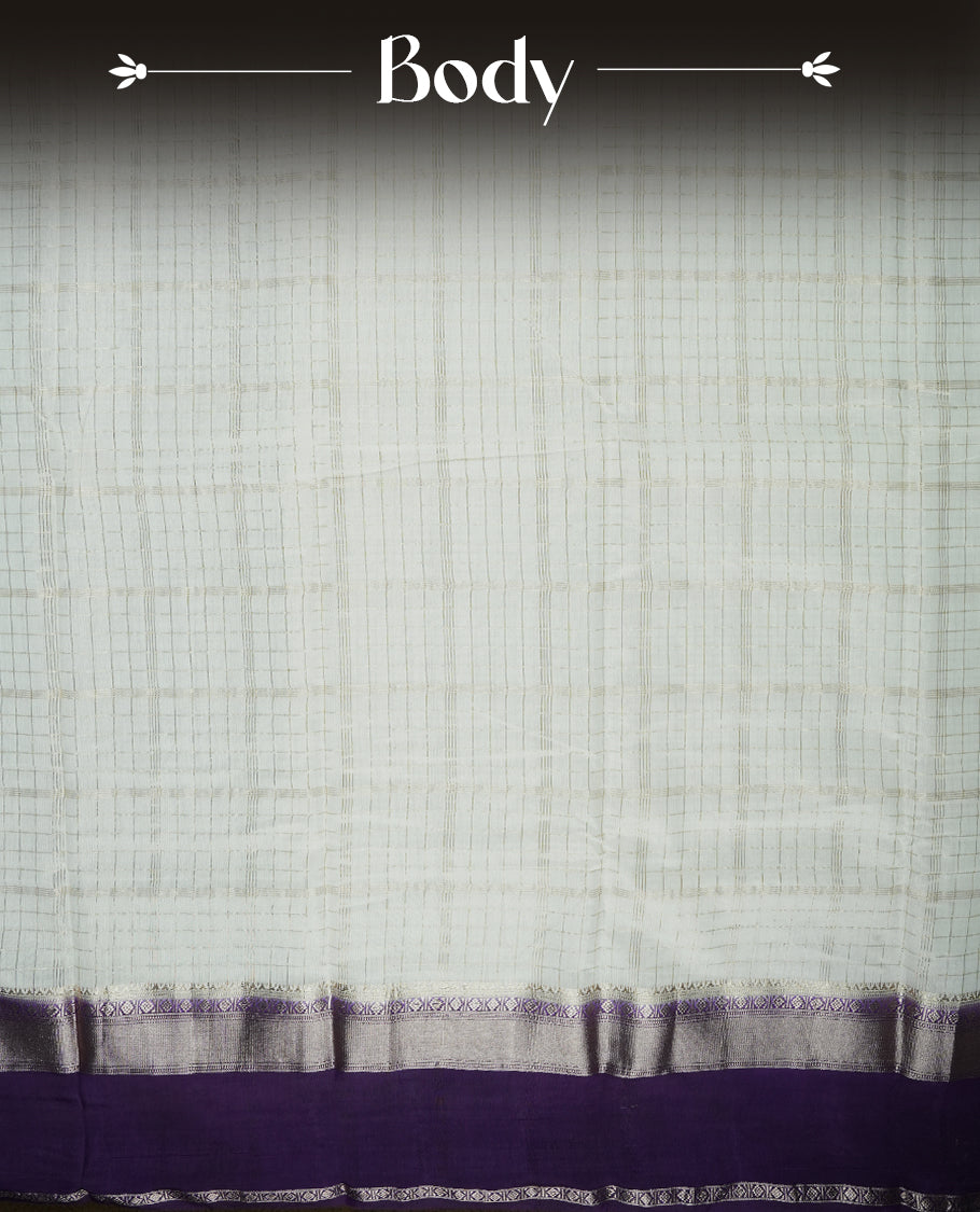 White colour mixed chanderi cotton saree with checkered body, deep purple pallu with rose gold zari border, and matching purple blouse.