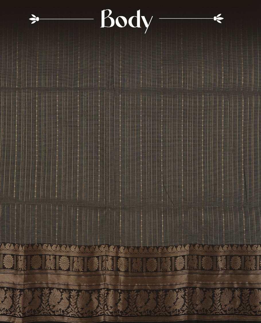 Grey colour Chettinad cotton saree featuring fine golden zari lines on the body, The contrasting black border is richly woven with intricate zari floral and paisley motifs & Comes with a matching blouse piece.