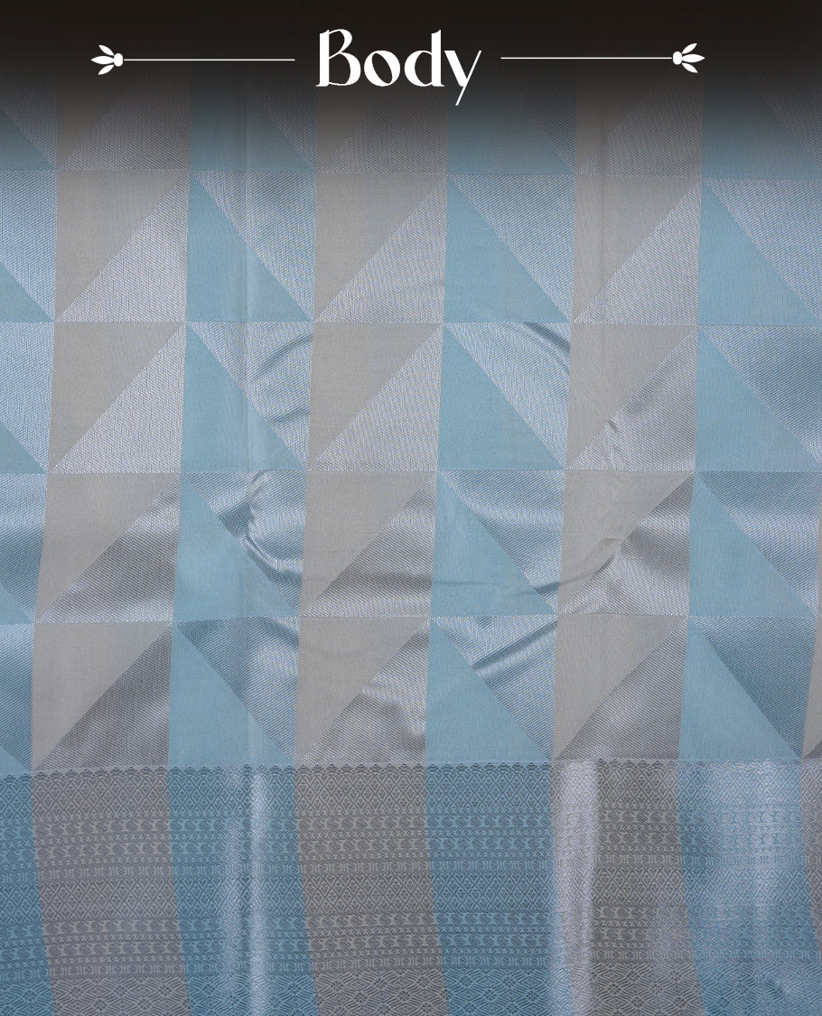 Ice blue & cream colour semi soft silk saree featuring a silver zari patterned body, complemented by silver zari motifes on pallu & border and a matching blouse piece.