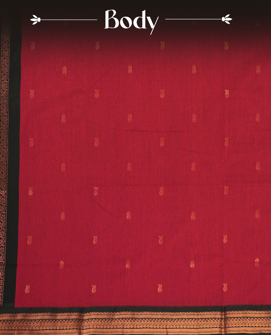 Deep maroon colour Kalyani cotton saree featuring delicate zari motifs work on the body, highlighted with an elegant contrast black zari woven border & Paired with a matching blouse.