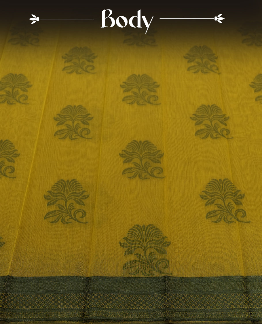 Olive green colour silk cotton saree featuring subtle woven motifs throughout the body, enhanced by a striking contrast border and an intricately designed pallu with floral patterns & Comes with a matching blouse piece.