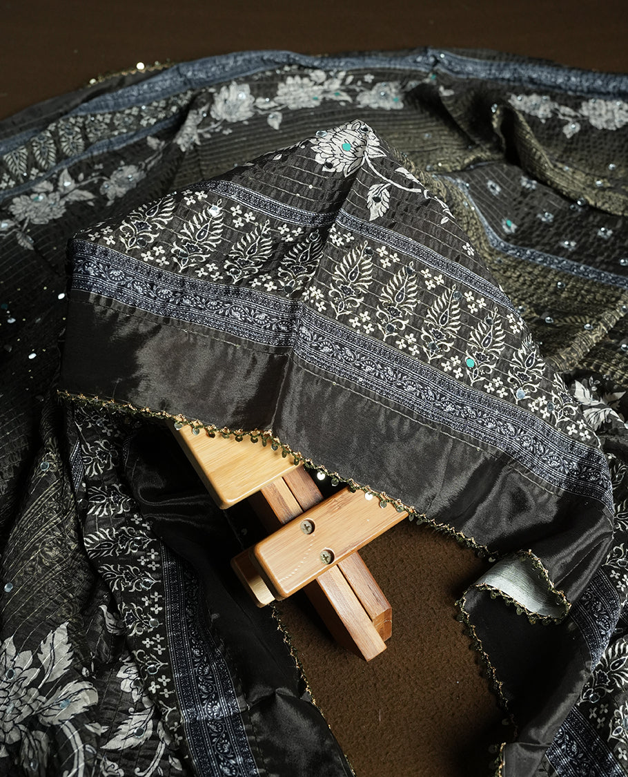 Dark Green colour churidhar material featuring Mirror and thread embroidery, foral print pattern on the self colour front panel, floral digital printed dupatta with elegant border, and matching plain bottom