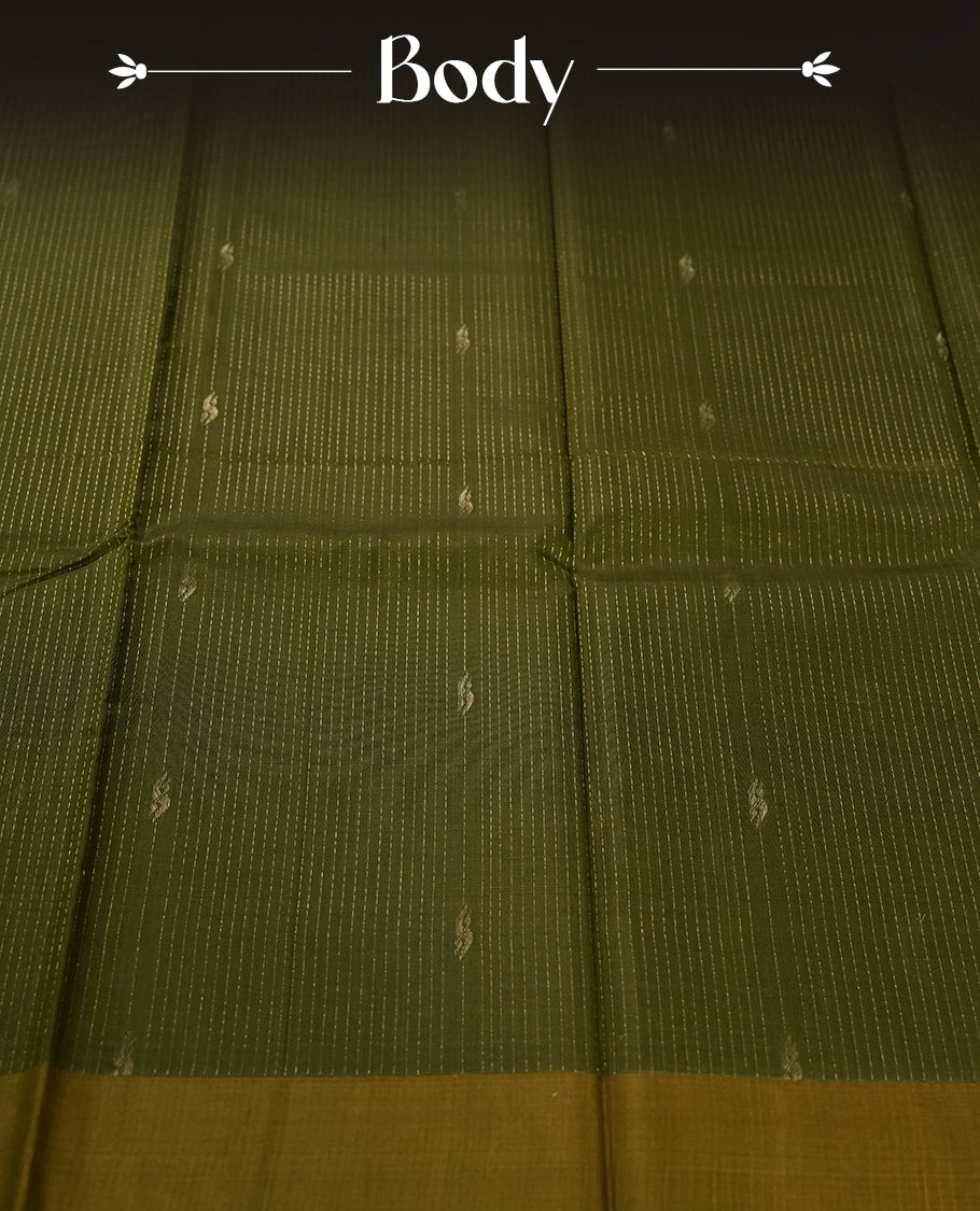Olive green colour pure handloom cotton saree featuring fine golden stripes with delicate motifs, paired with a rich zari border for a traditional yet elegant look, perfect for graceful occasions & Comes with matching blouse.