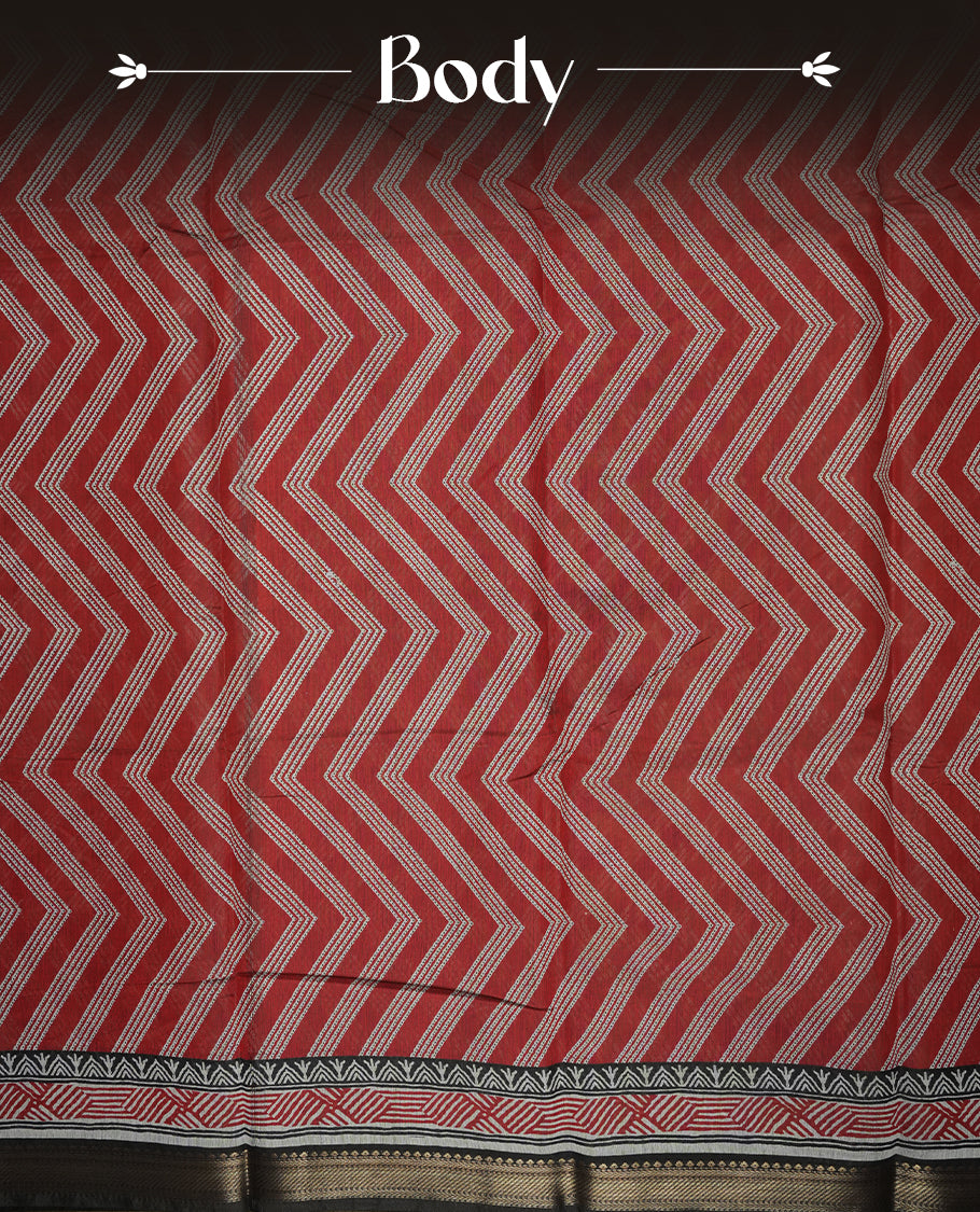 brick red colour mixed chanderi cotton saree with zigzag body pattern, printed geometric pallu with floral border, golden zari border, matching brick red blouse.