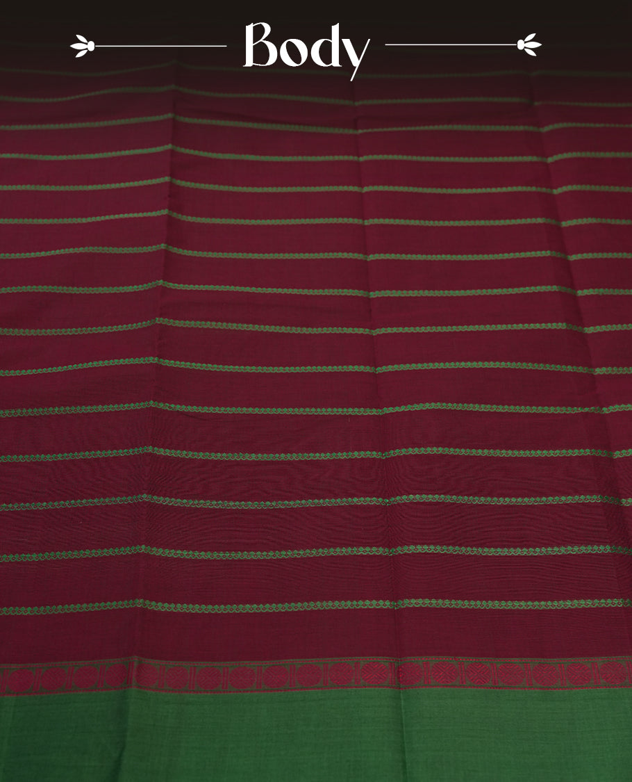 Maroon colour Pure Kanchi cotton saree with subtle green stripes and a contrasting green border & Includes a matching blouse piece for a complete look.