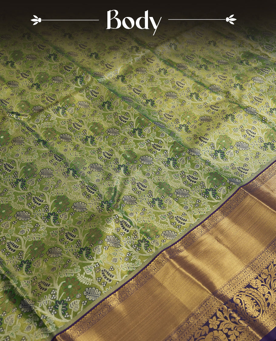 Light green colour and Antique silver Zari Tissue Brocade Saree features intricate floral Motifs on body and navy blue colour traditional border & pallu with floral patterns, paired with matching blouse