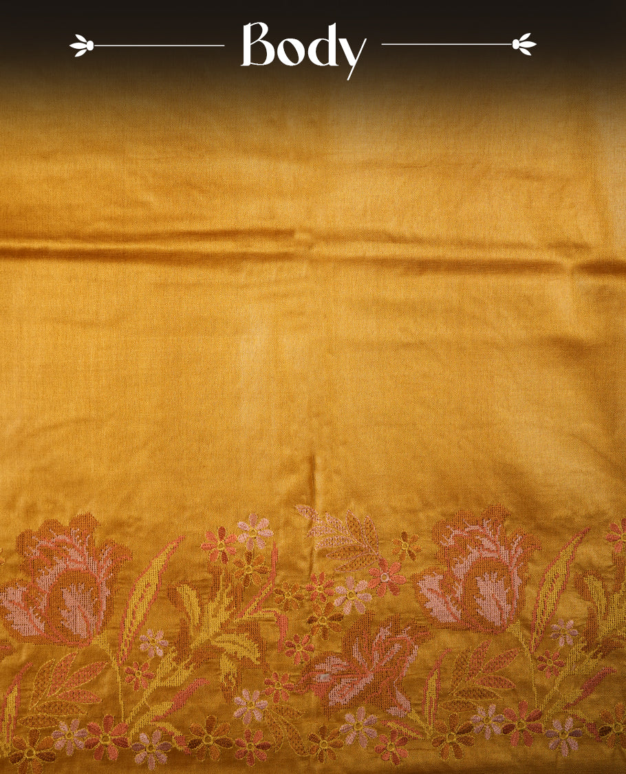 Mustard colour Pure tusser silk saree featuring finely crafted floral thread embroidery detailing on the border, pallu and with matching blouse piece.