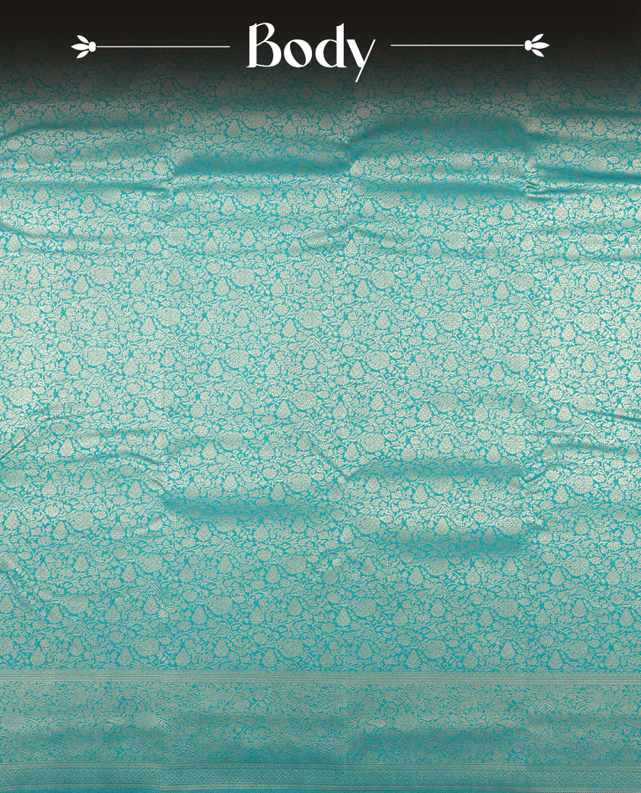 Aqua blue colour semi silk brocade saree featuring intricate Gold Floral kodi patterns across the body, complemented by a rich self colour woven border and pallu, paired with a matching blouse.