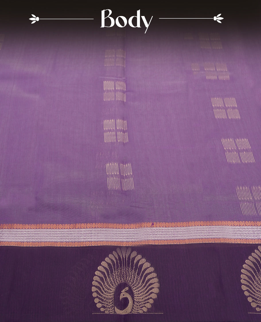 Purple colour tissue cotton saree featuring elegant silver & copper zari motifs, a delicate zari border, and a beautifully woven pallu & Paired with a matching blouse, perfect for festive and traditional occasions.