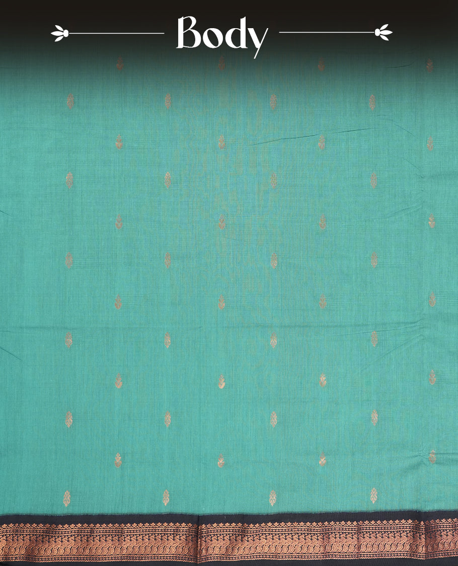 Sky blue colour Kalyani cotton saree with subtle zari motifs all over, paired with a contrasting rich navy blue copper peacock zari woven border and pallu & comes with a matching blouse piece.