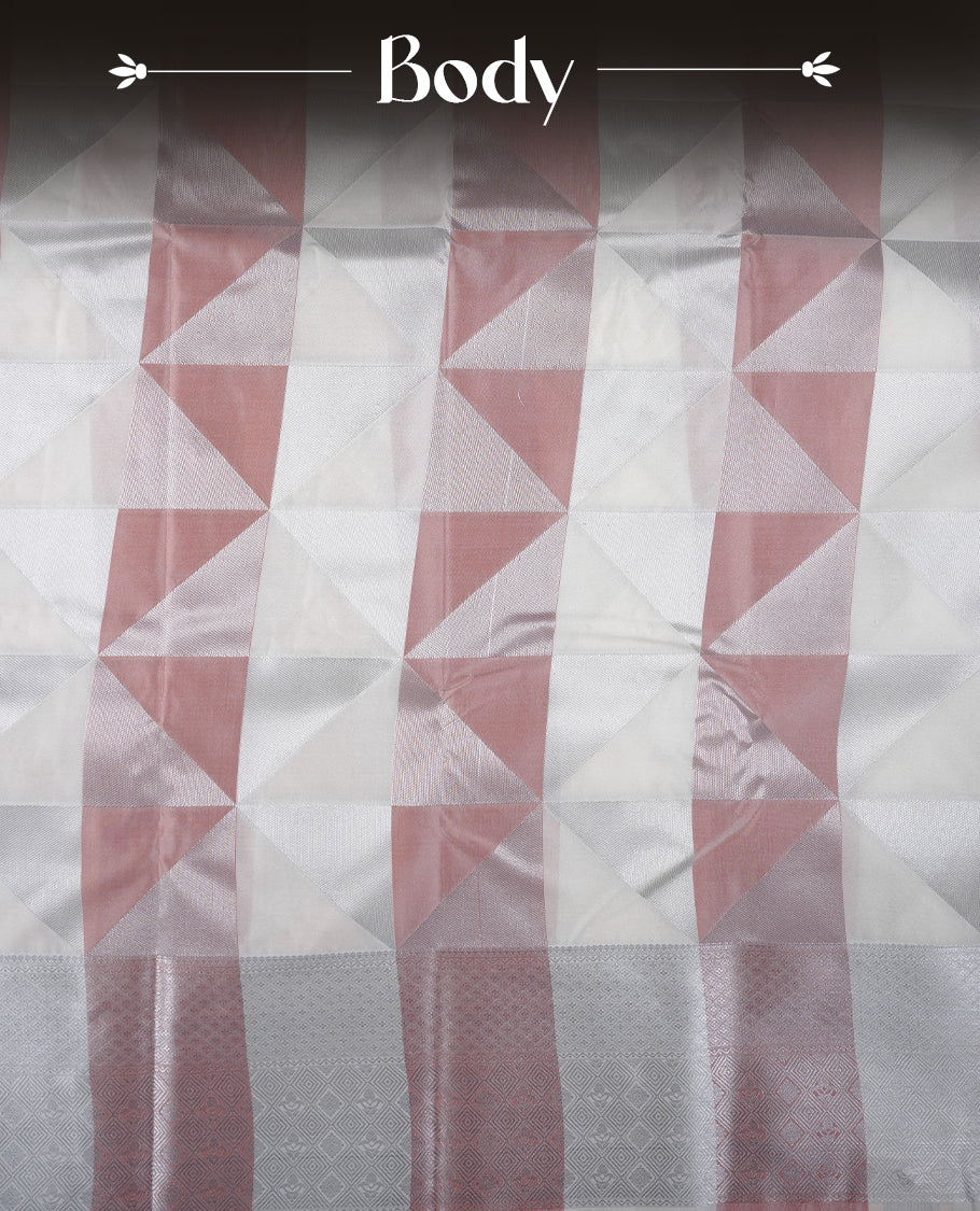 Peach & cream colour semi soft silk saree featuring a silver zari patterned body, complemented by silver zari motifes on pallu & border and a matching blouse piece.