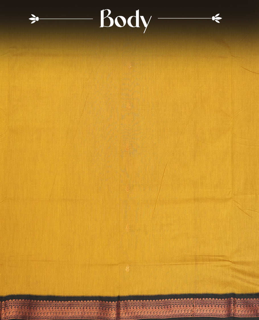 Golden yellow colour Kalyani cotton saree with intricate small motifs all over, paired with a contrasting navy blue rich zari woven border and pallu & Comes with a matching blouse piece.