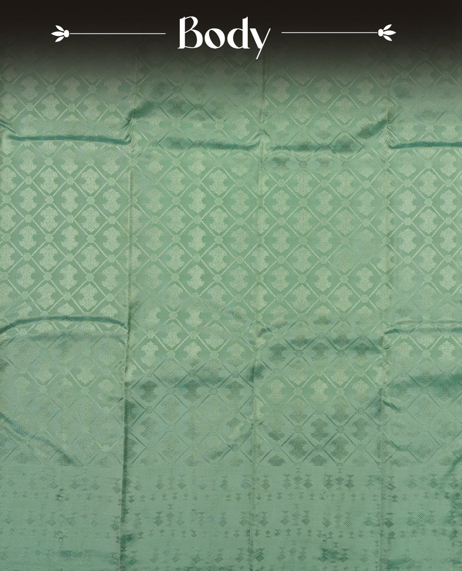 Mint Green colour semi soft silk saree featuring a self coloured textured square motufs on body, complemented by self coloured Square motifs pallu & border and a matching blouse piece.