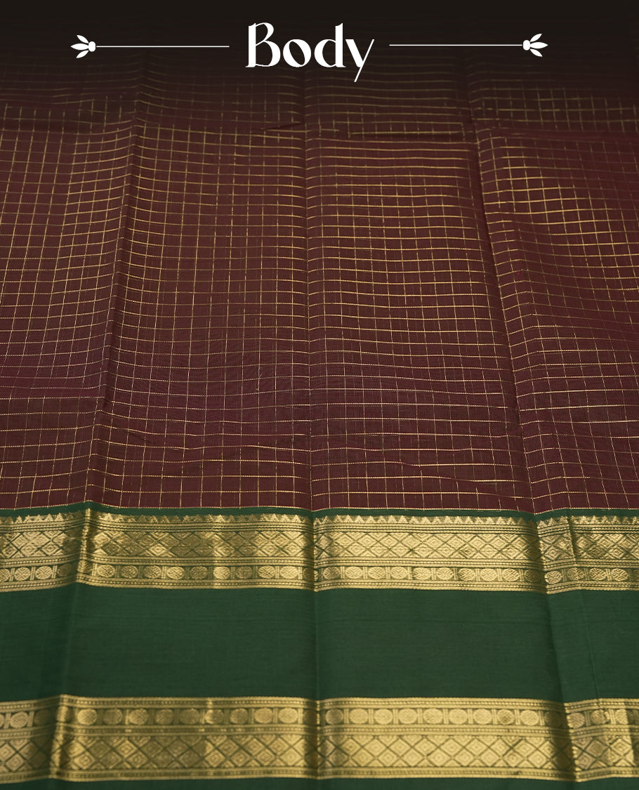 Dark Coffee Brown colour pure Kanchi cotton saree featuring with delicate golden checks on body, paired with a contrasting green zari woven border & Includes a matching blouse piece for a complete look.