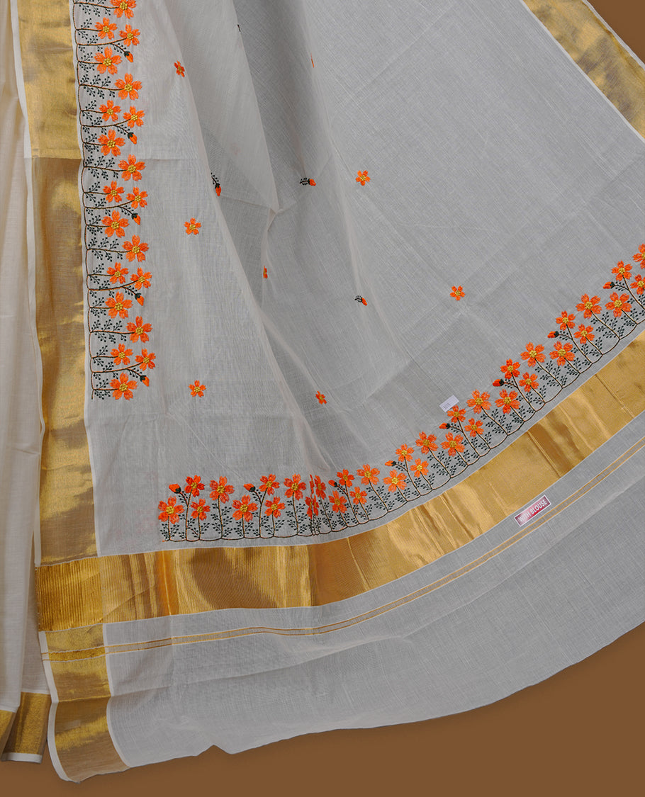 Off-white colour Kerala saree with a classic gold kasavu border, delicately embroidered floral motifs in orange and green across the body and pallu, finished with a subtle golden sheen for timeless elegance.