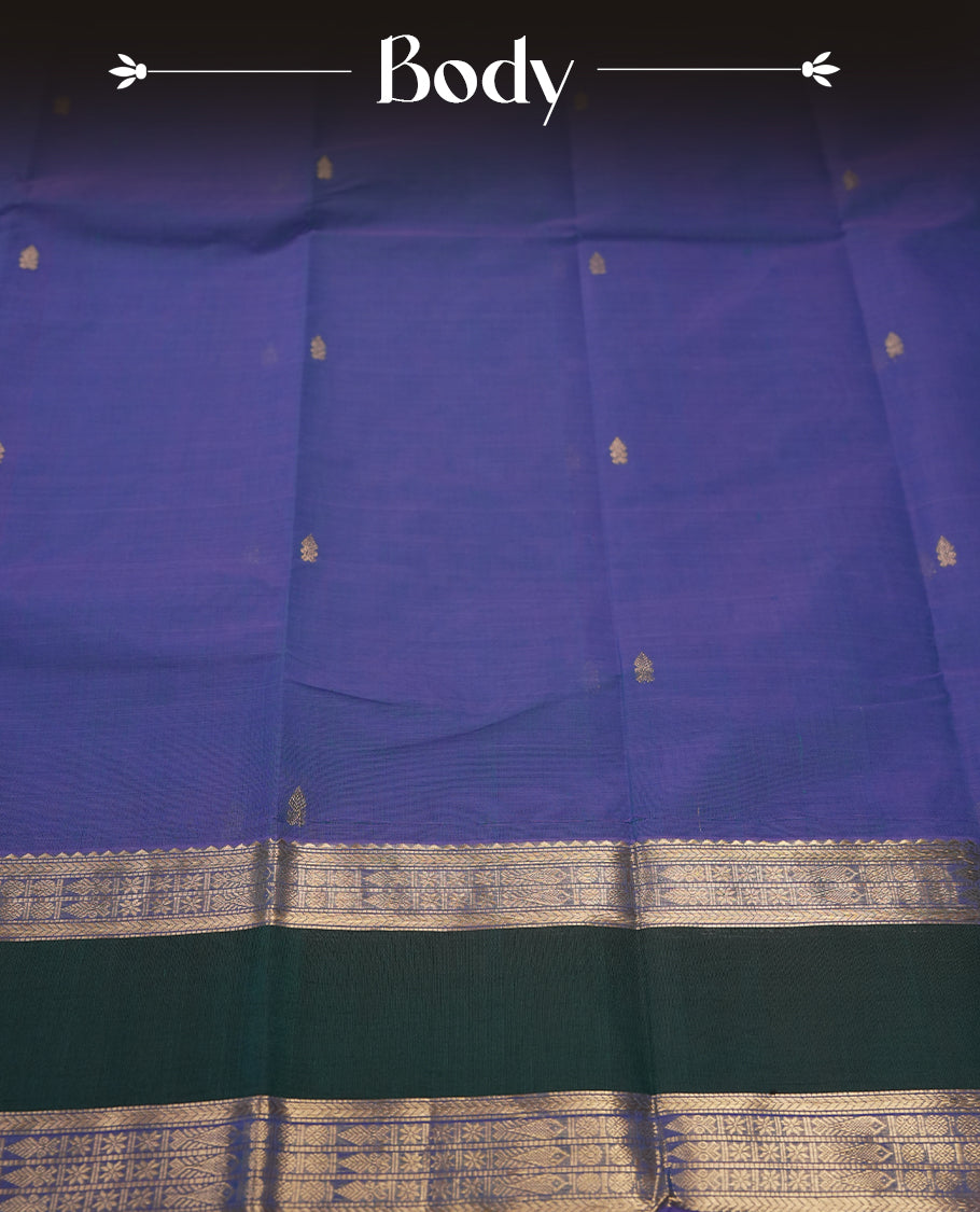 Blue & Purple Double shaded colour pure Kanchi cotton saree with subtle buttas, enhanced by a contrasting green border with rich silver zari wor & Paired with a matching blouse, it offers an elegant and traditional appeal for any occasion.