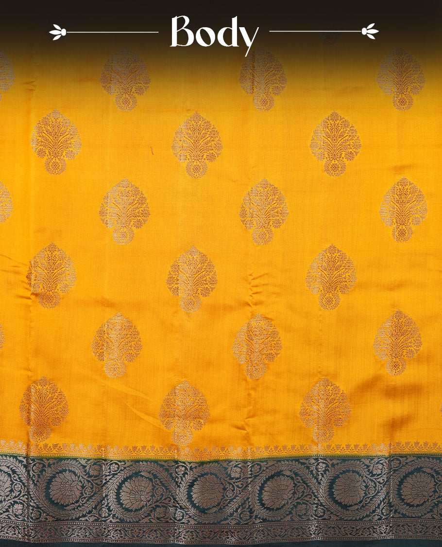 Mustard Colour Pure Banaras soft Silk Saree having gold floral motifs on Body with contrast Teal colour gold Floral kodi pattern on Border and matching Blouse