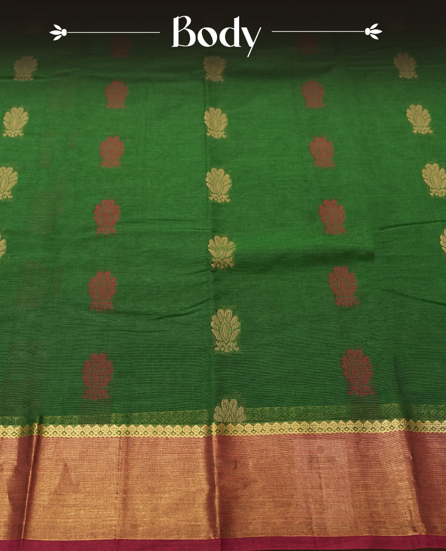 Emerald Green colour Silk Cotton Saree with Dual-Tone Zari Butta Motifs on the Body, Contrasting Antique Gold Tissue Border Accented with Maroon Selvedge, and a Coordinated Matching Blouse Piece