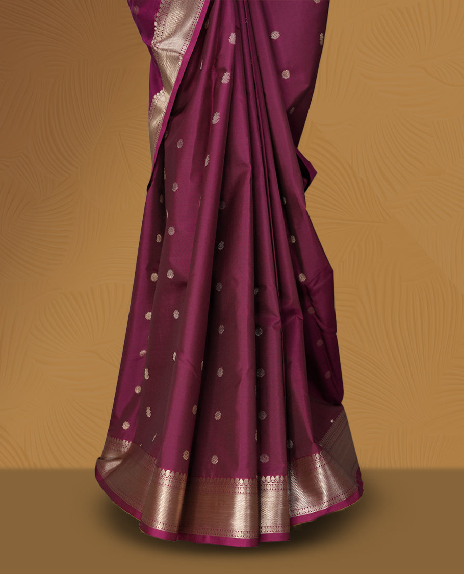 Mulberry colour soft silk saree featuring fawn gold colour buttas and a lustrous fawn gold colour zari border with matching pallu & Paired with a matching blouse.