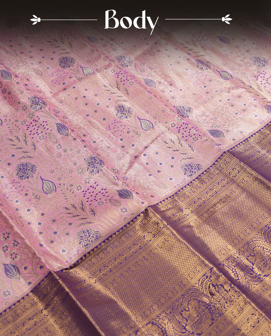 Pink colour and Antique gold Zari Tissue Brocade Saree features intricate blue colourred floral Motifs on body and a navy blue colour traditional border & pallu with floral patterns, paired with matching blouse