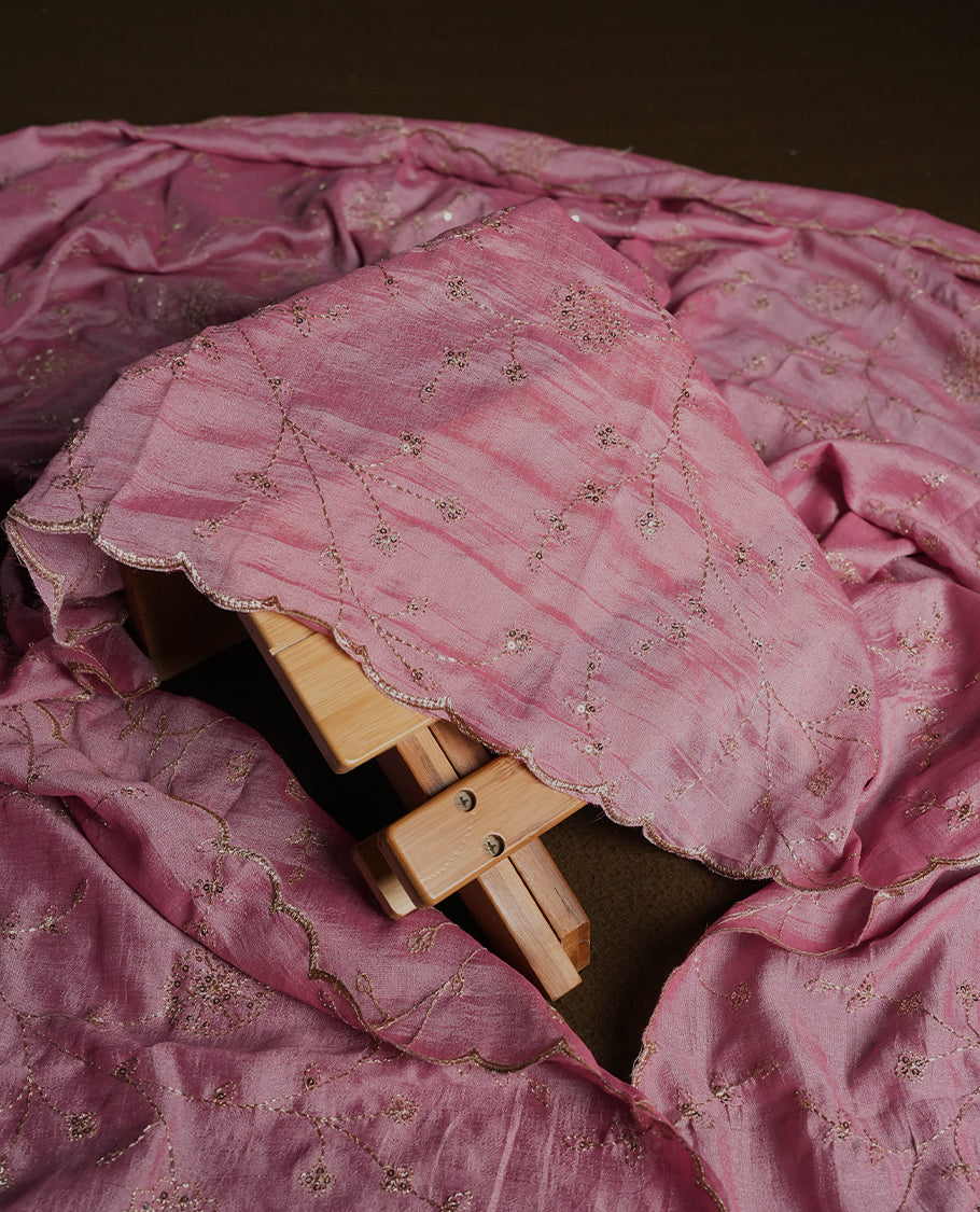 Dark pink colour churidhar material featuring thread embroidery on the front panel, contrast Light pink dupatta with elegant border, and matching plain bottom